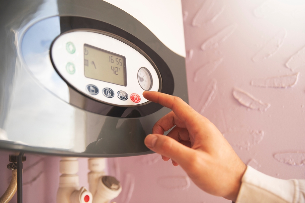 Professional plumber installing a tankless water heater in a Healdsburg home